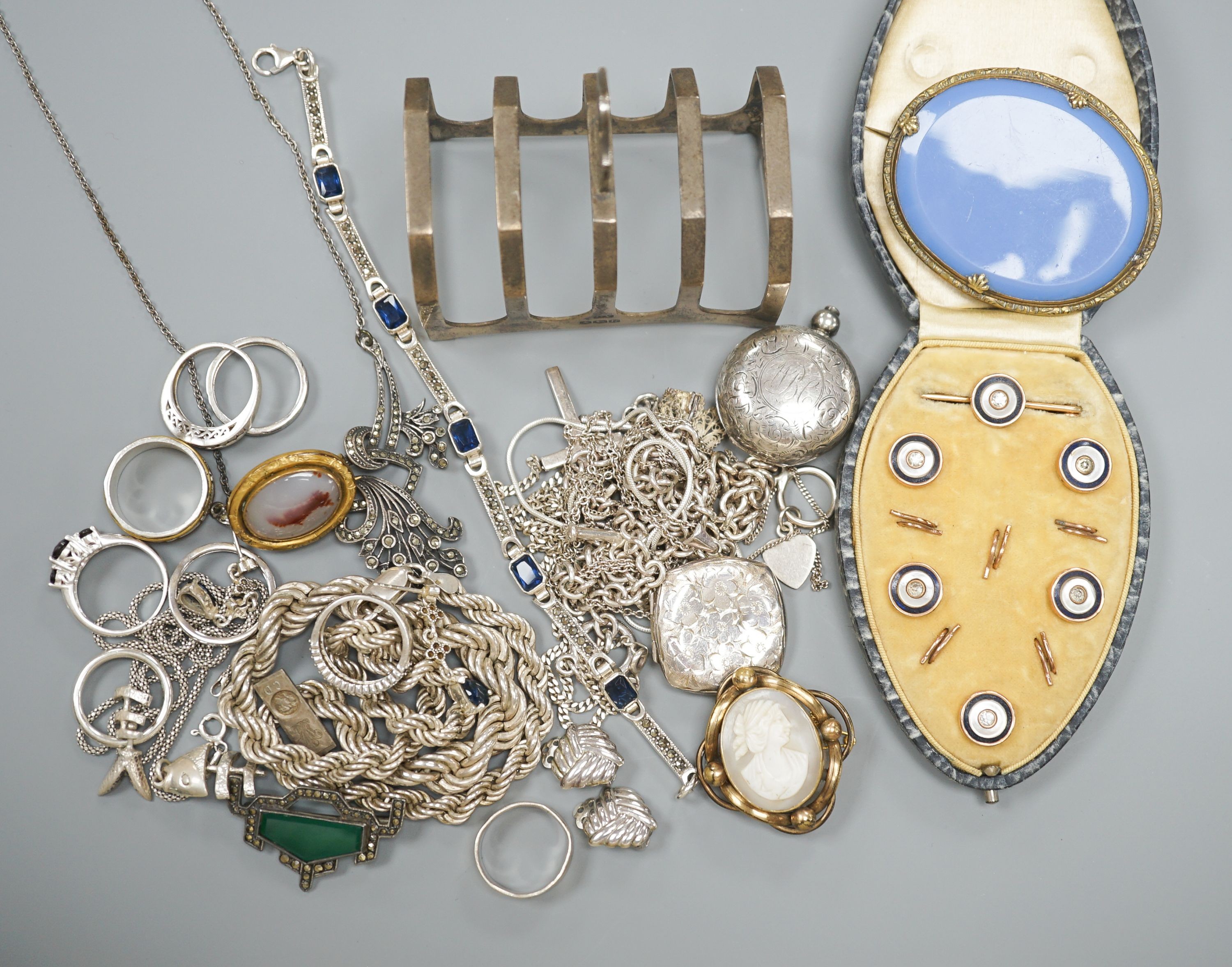 Mixed jewellery including silver and costume, together with a silver toastrack, a silver sovereign case, etc.